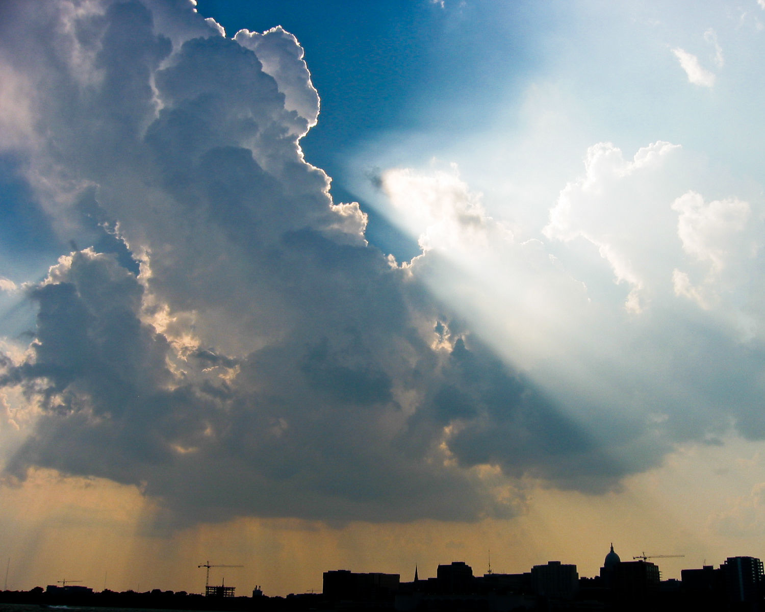 Towering cumulus and crepuscular rays